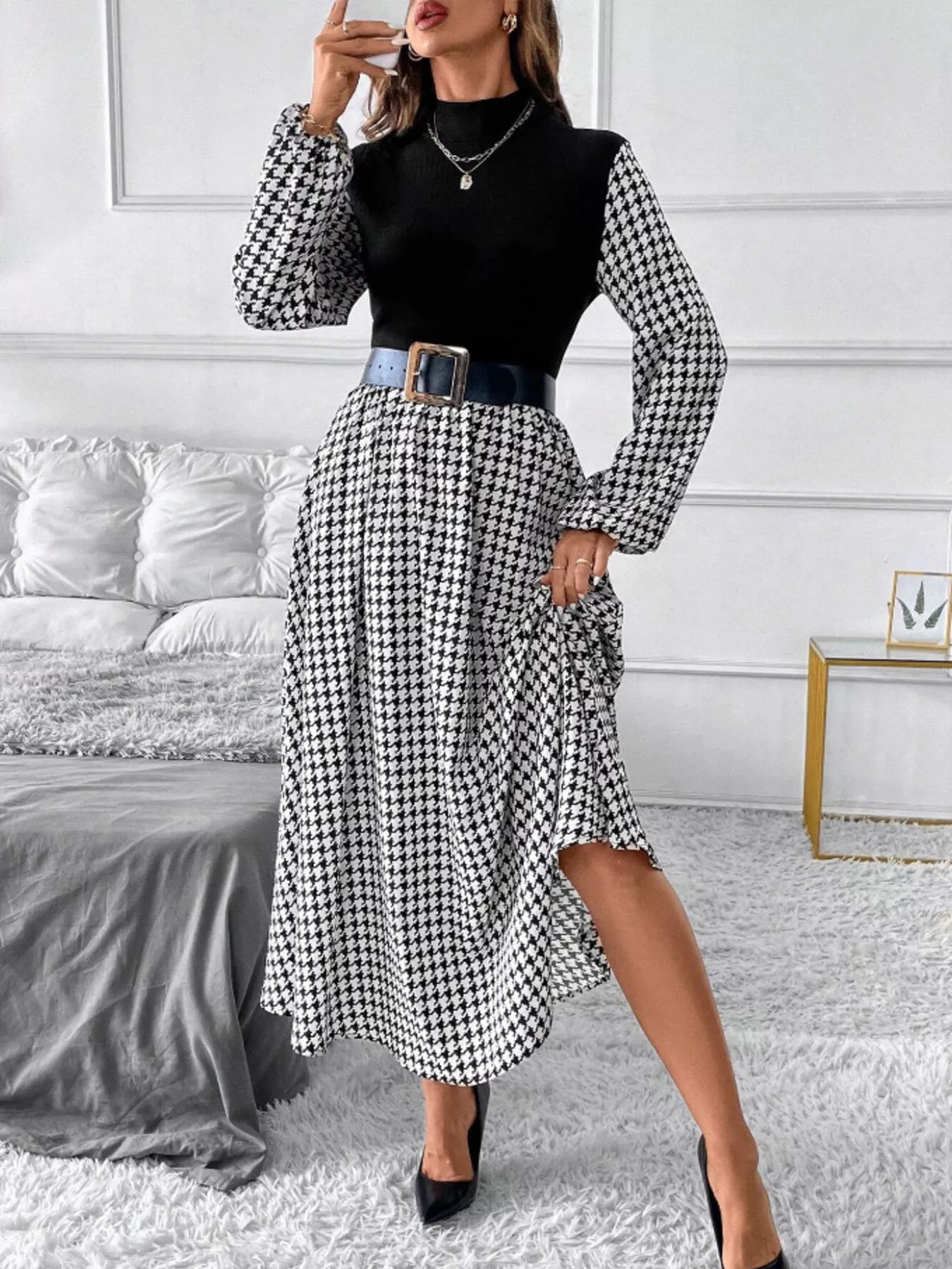 Houndstooth mock-neck A-line dress with black bodice, belted waist, midi length.