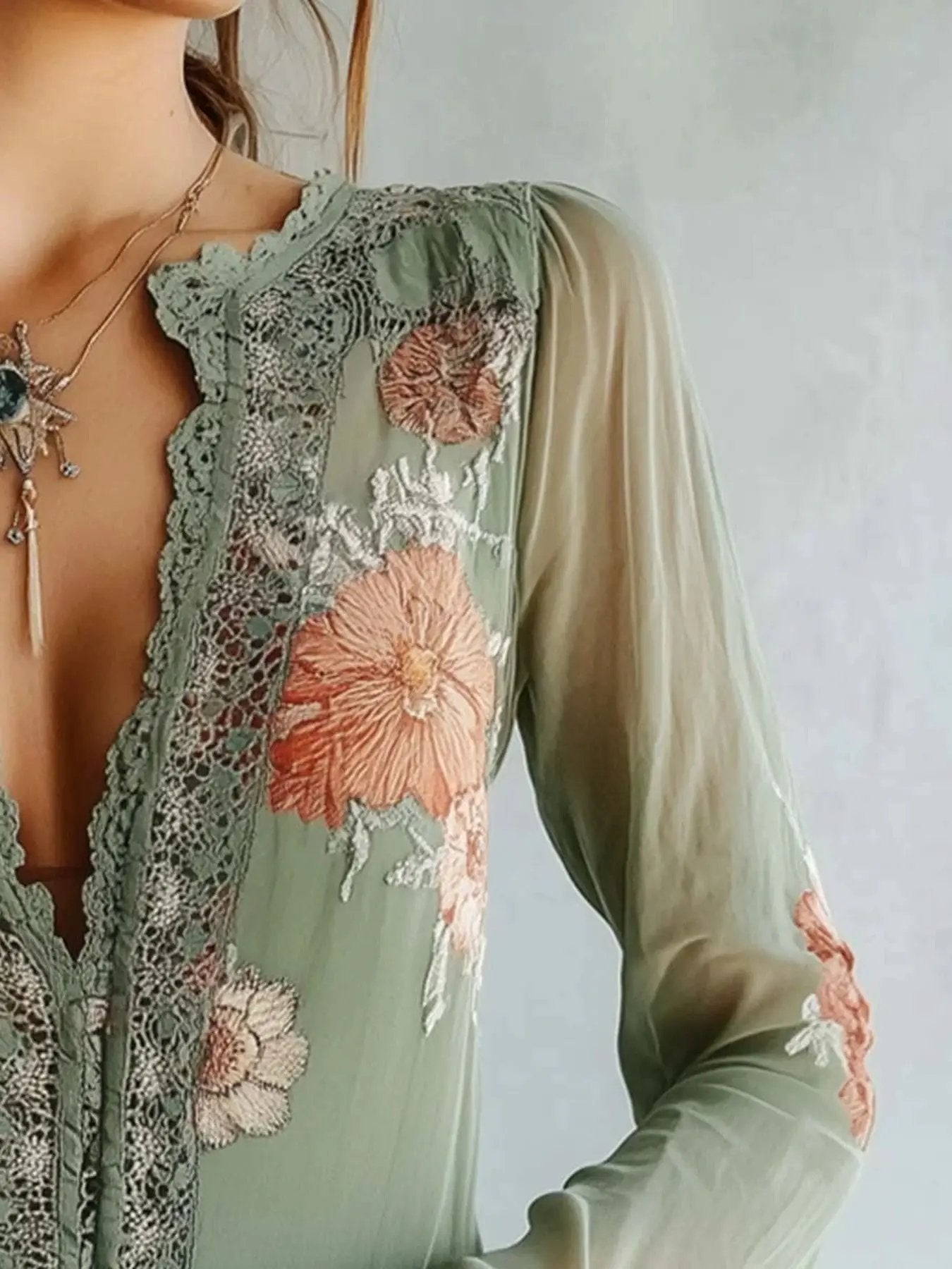 Lace-detail floral blouse in sage green with pink embroidery and sheer sleeves