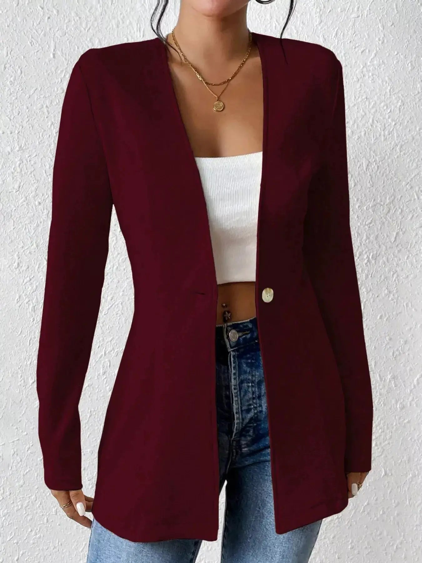 Single-Button Long Sleeve Blazer by Belle Bijouix in burgundy, worn over a white crop top
