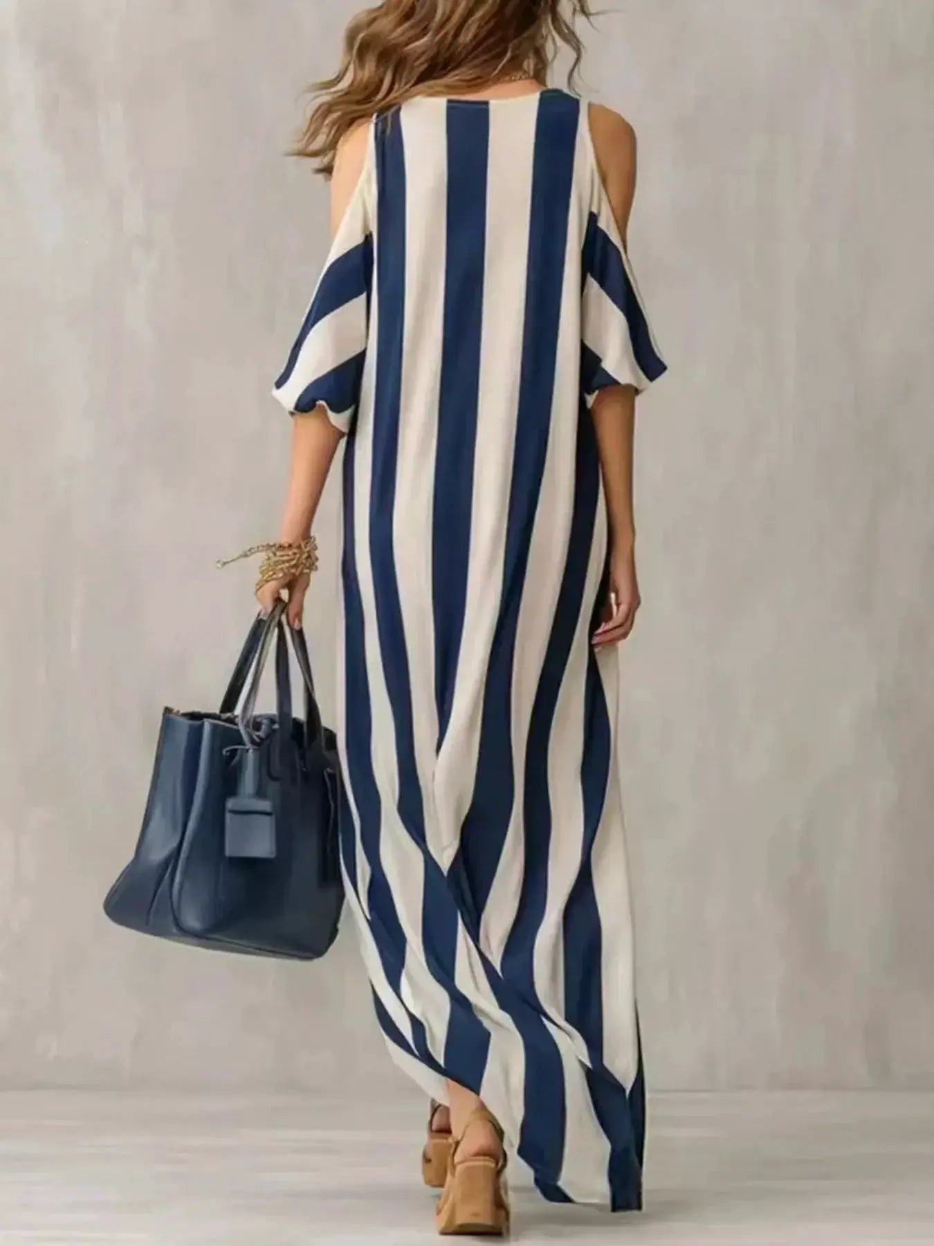 Striped cold-shoulder maxi dress with side slit in blue and white vertical stripes