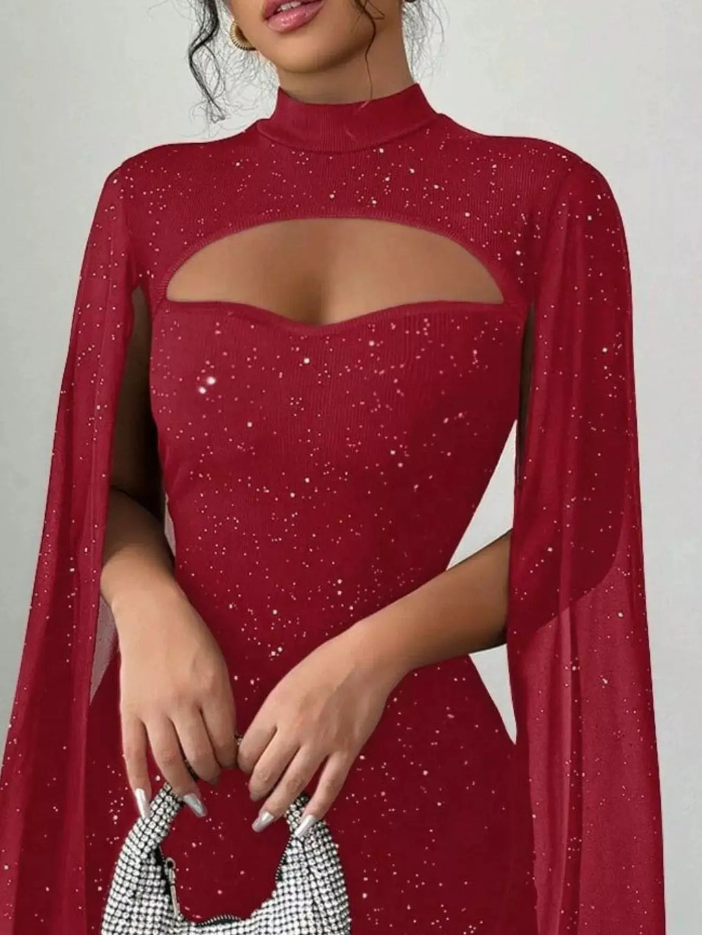 Cutout bodycon mini dress with cape sleeves in red glitter knit fabric