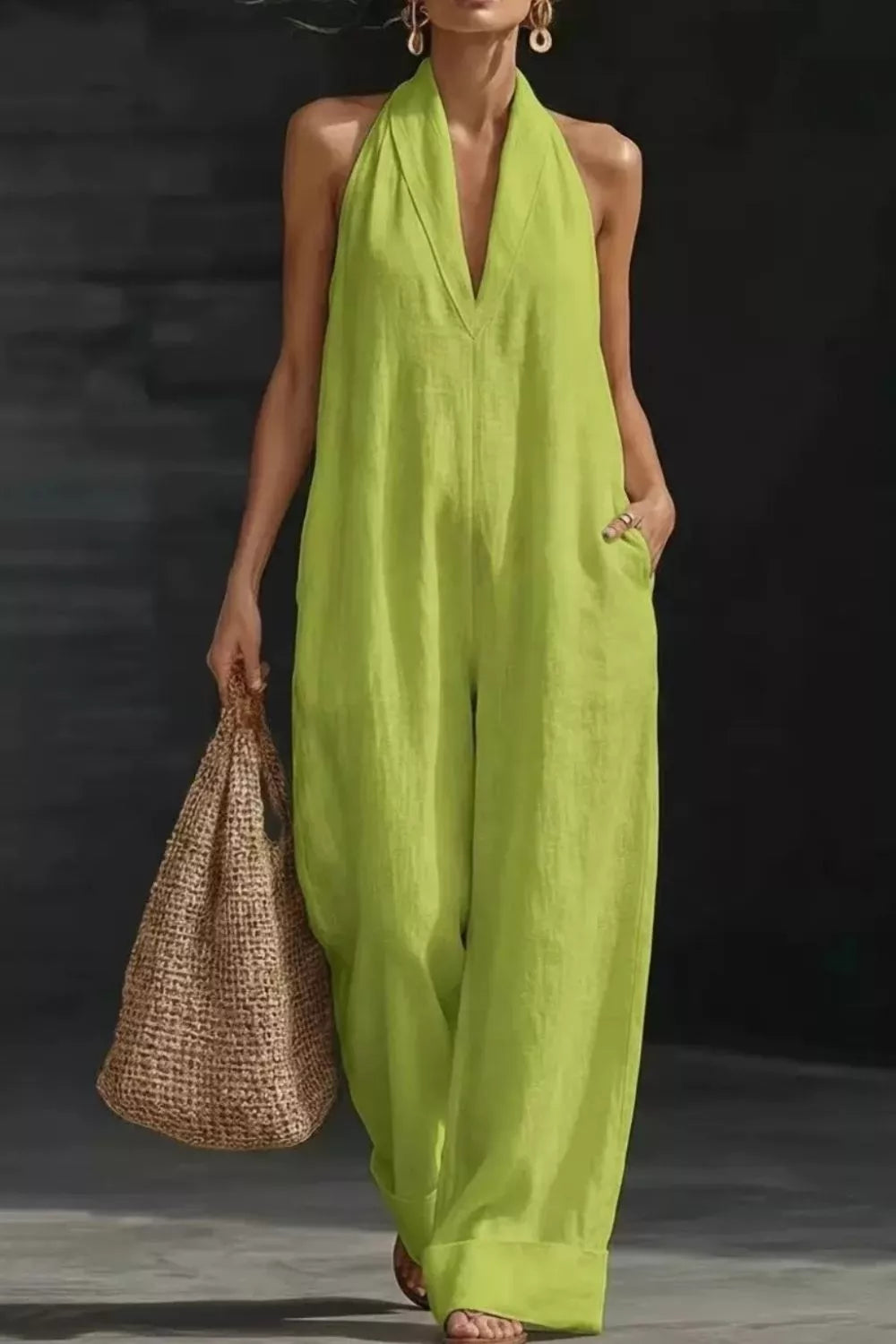 Sleeveless neon lime green wide-leg jumpsuit with halter neckline and side pockets.