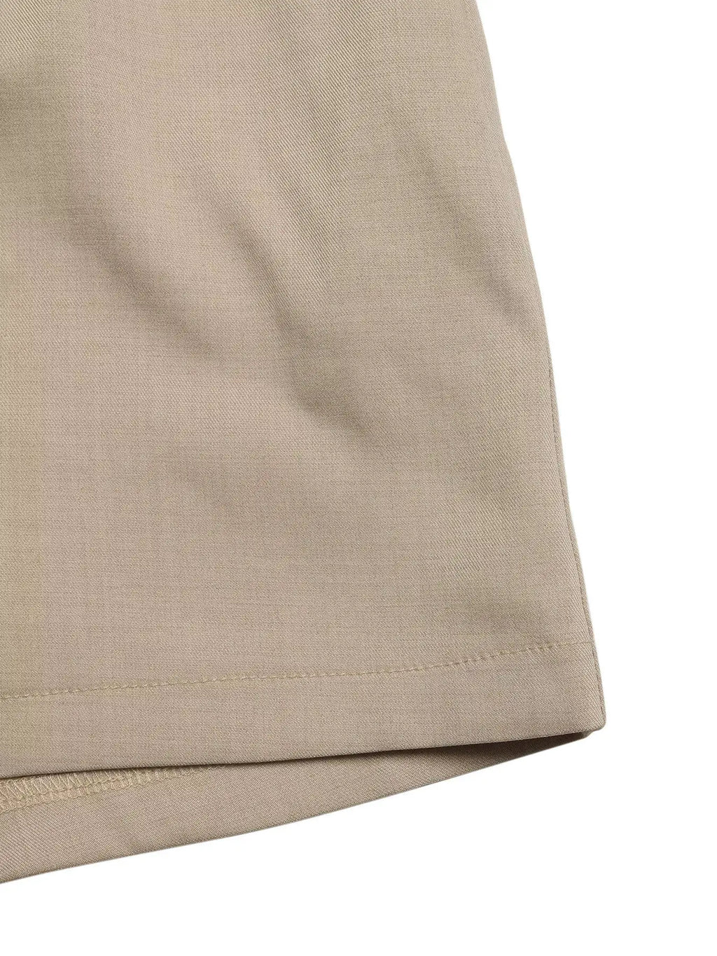 Sleeveless Button-Down Tie Waist Romper in beige twill with stitched hem