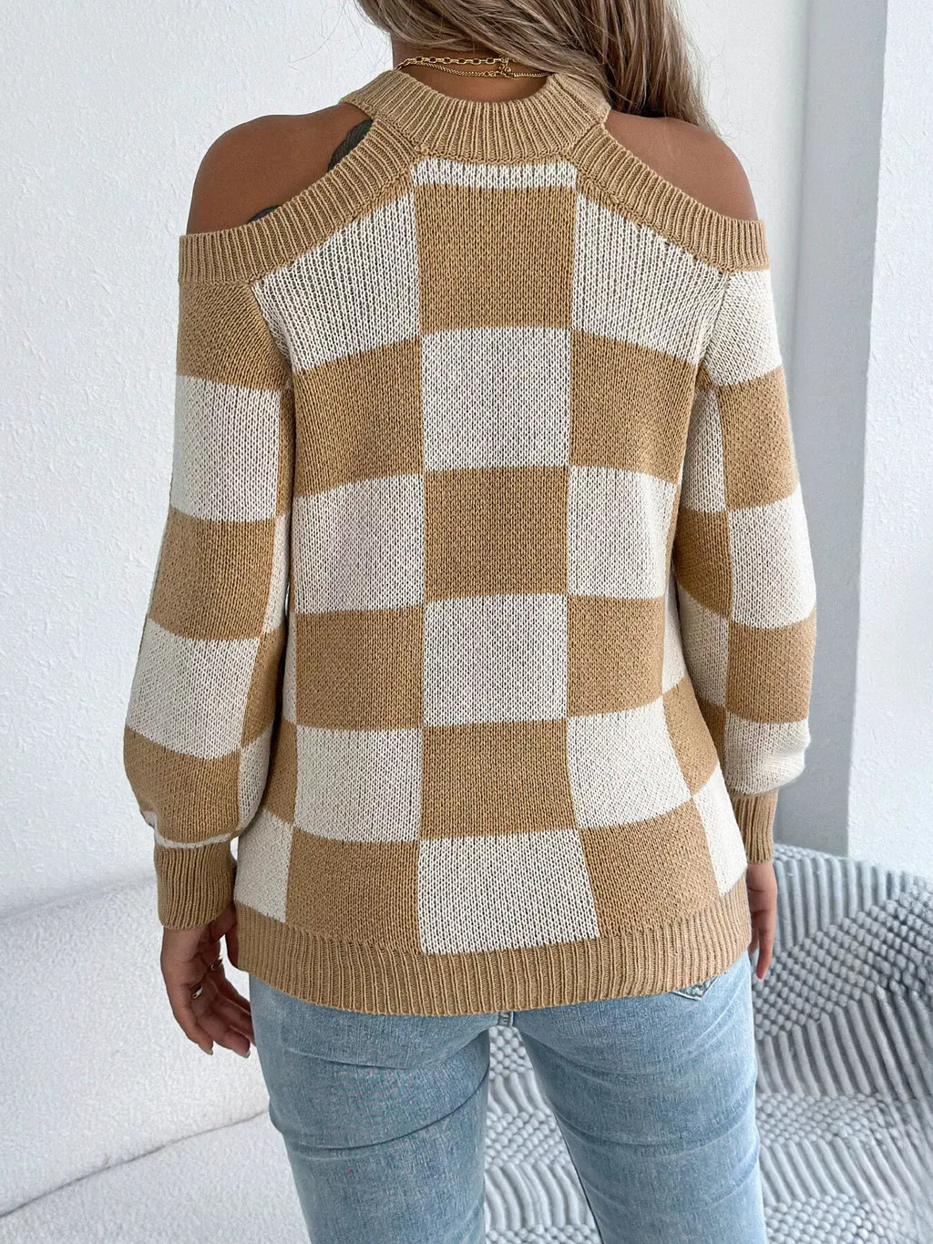 Cold shoulder checkered long-sleeve knit sweater in beige and cream with ribbed trim