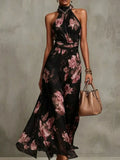 Full Size Floral Print Sleeveless Halter Maxi Dress in black with pink blooms and wrapped waist