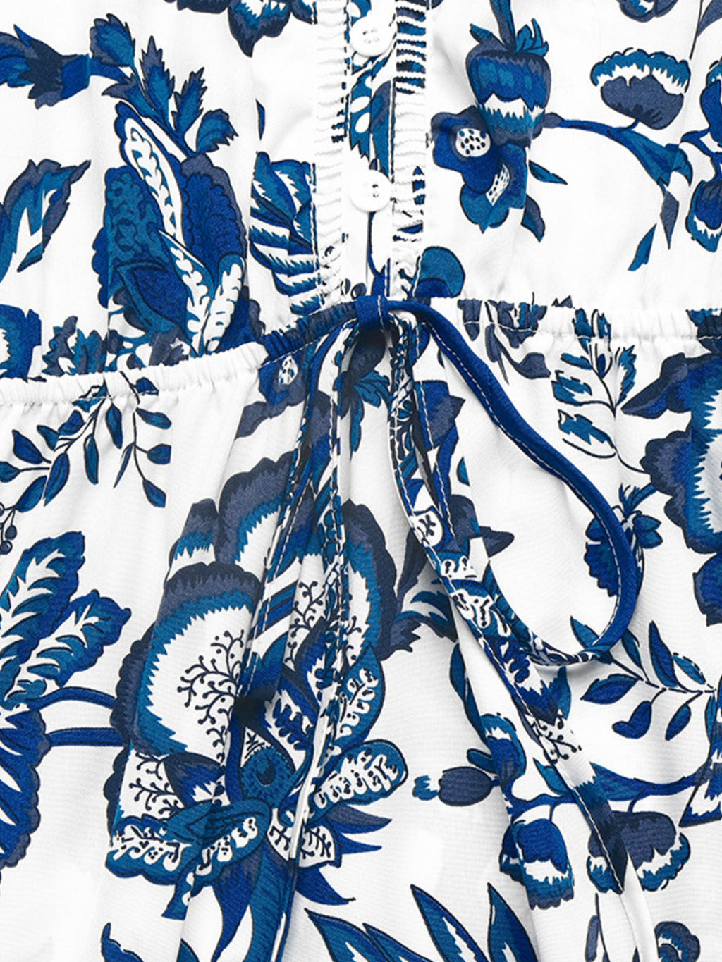 Floral print sleeveless V-neck midi dress by Bellebijouix, white with blue florals, buttoned front and tie waist
