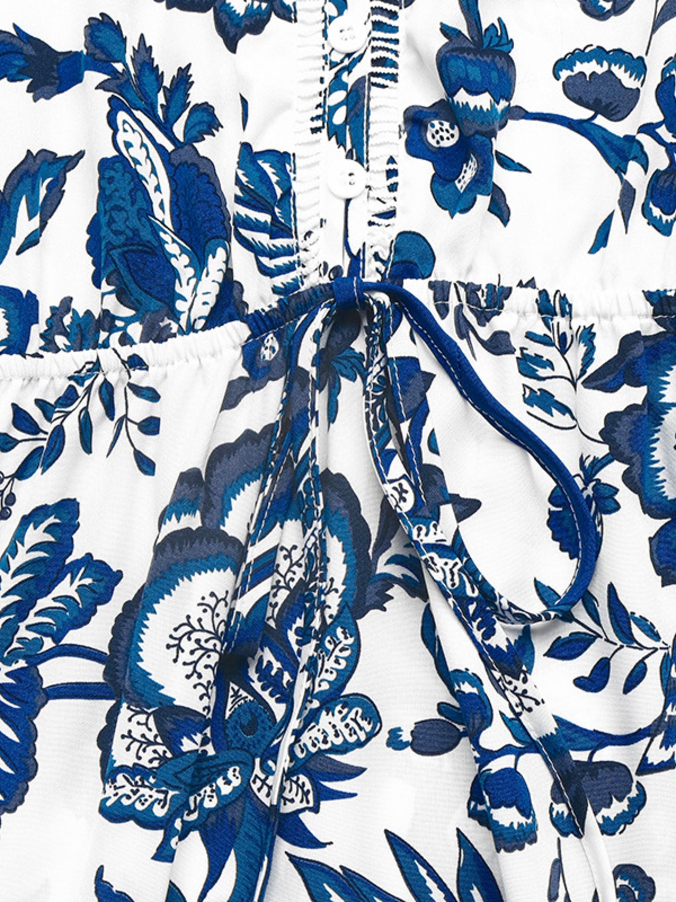 Floral print sleeveless V-neck midi dress by Bellebijouix, white with blue florals, buttoned front and tie waist