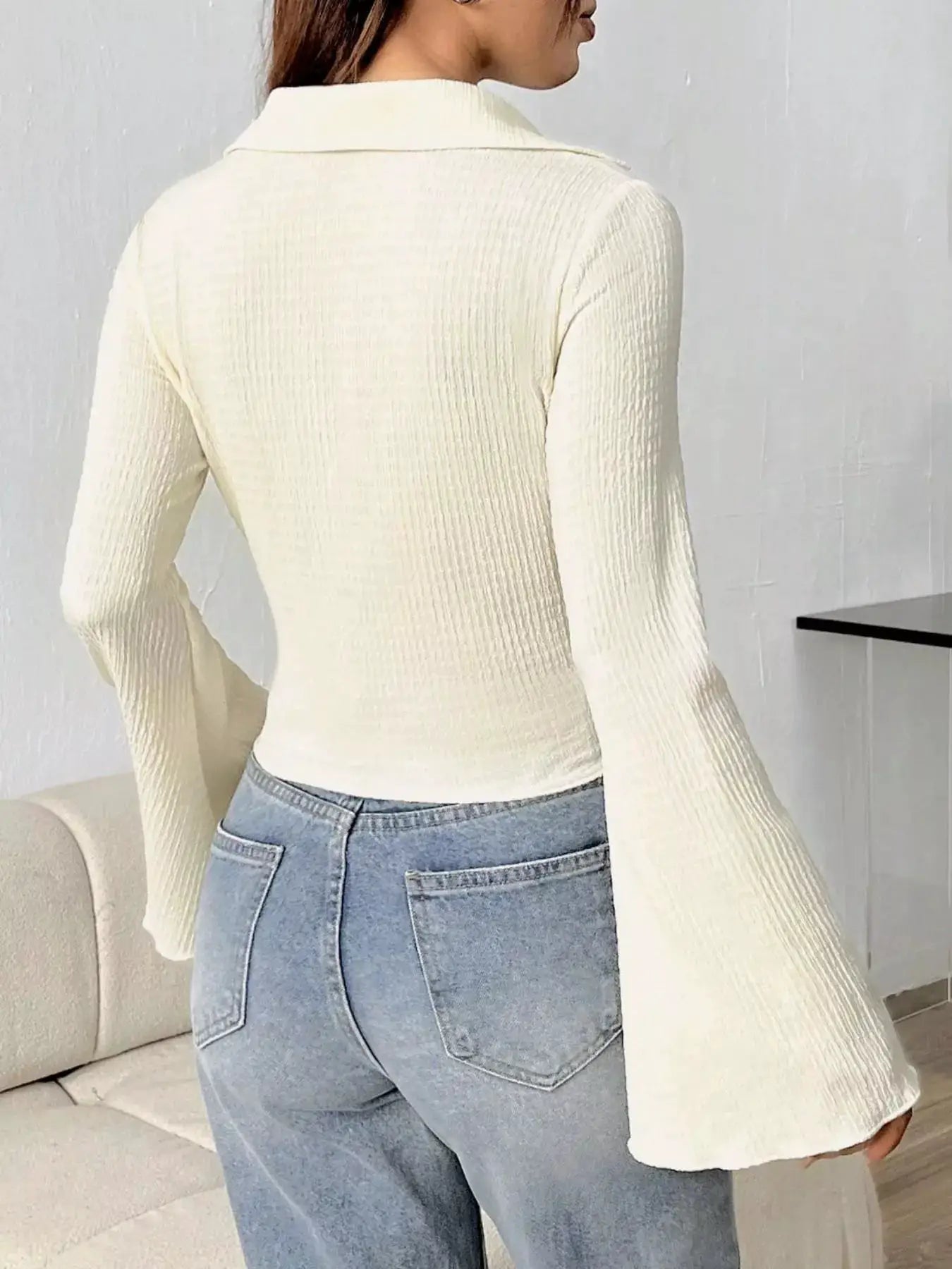 Button Up Flare Sleeve Top in cream ribbed knit; long sleeves with a collared neckline.