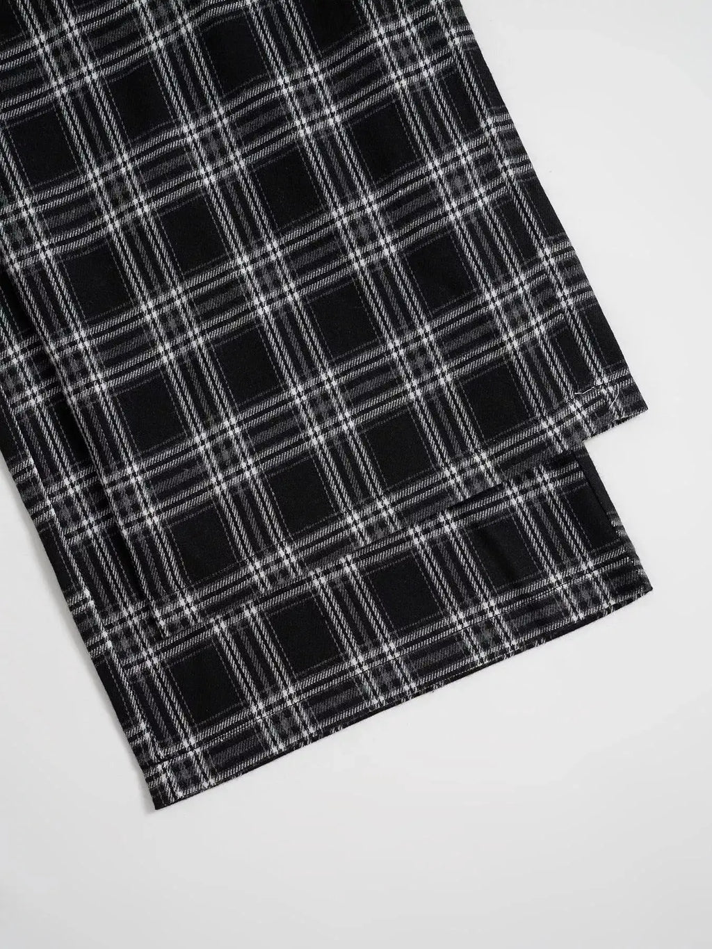 Relaxed Fit Plaid Pants in black-and-white check, close-up hem view