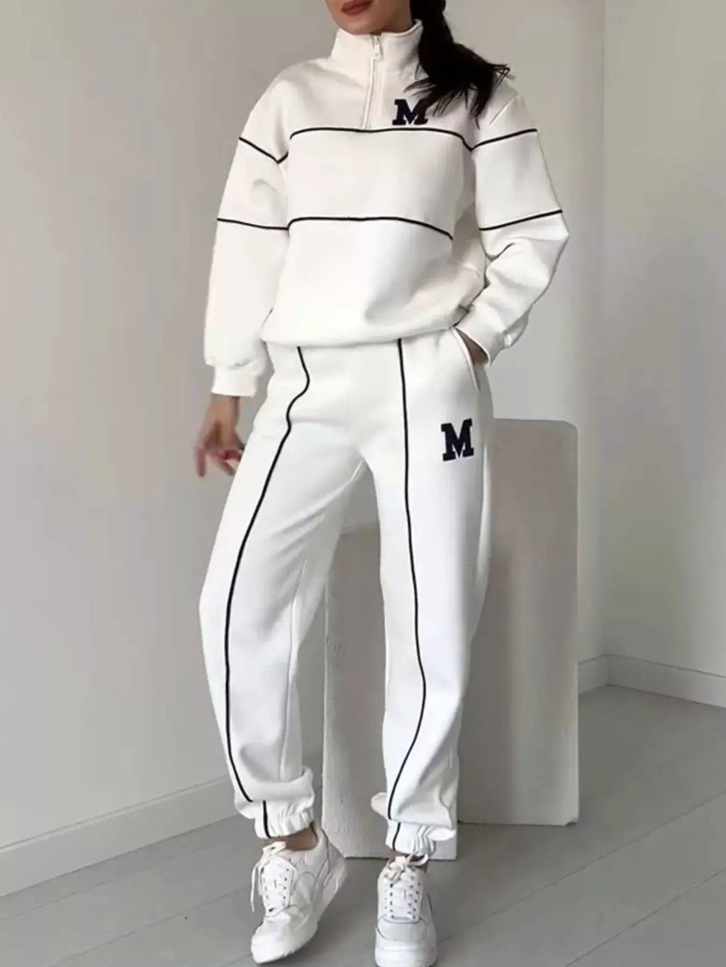 Plus-size white striped activewear set with black piping, zipper top and pockets, M logos