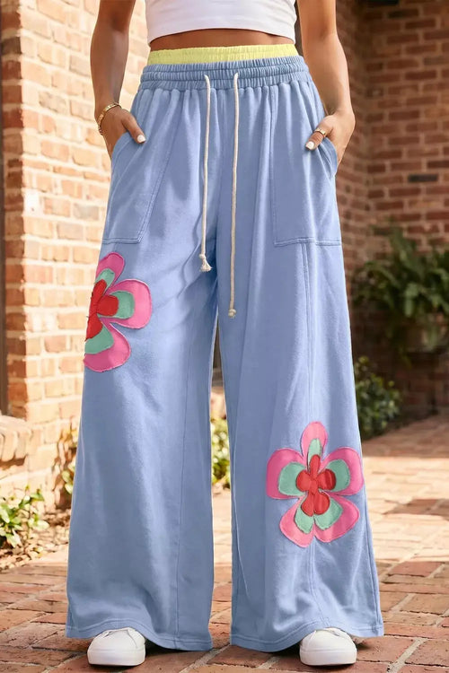 Blue wide-leg pants with color-block flower patchwork, drawstring elastic waist and pockets
