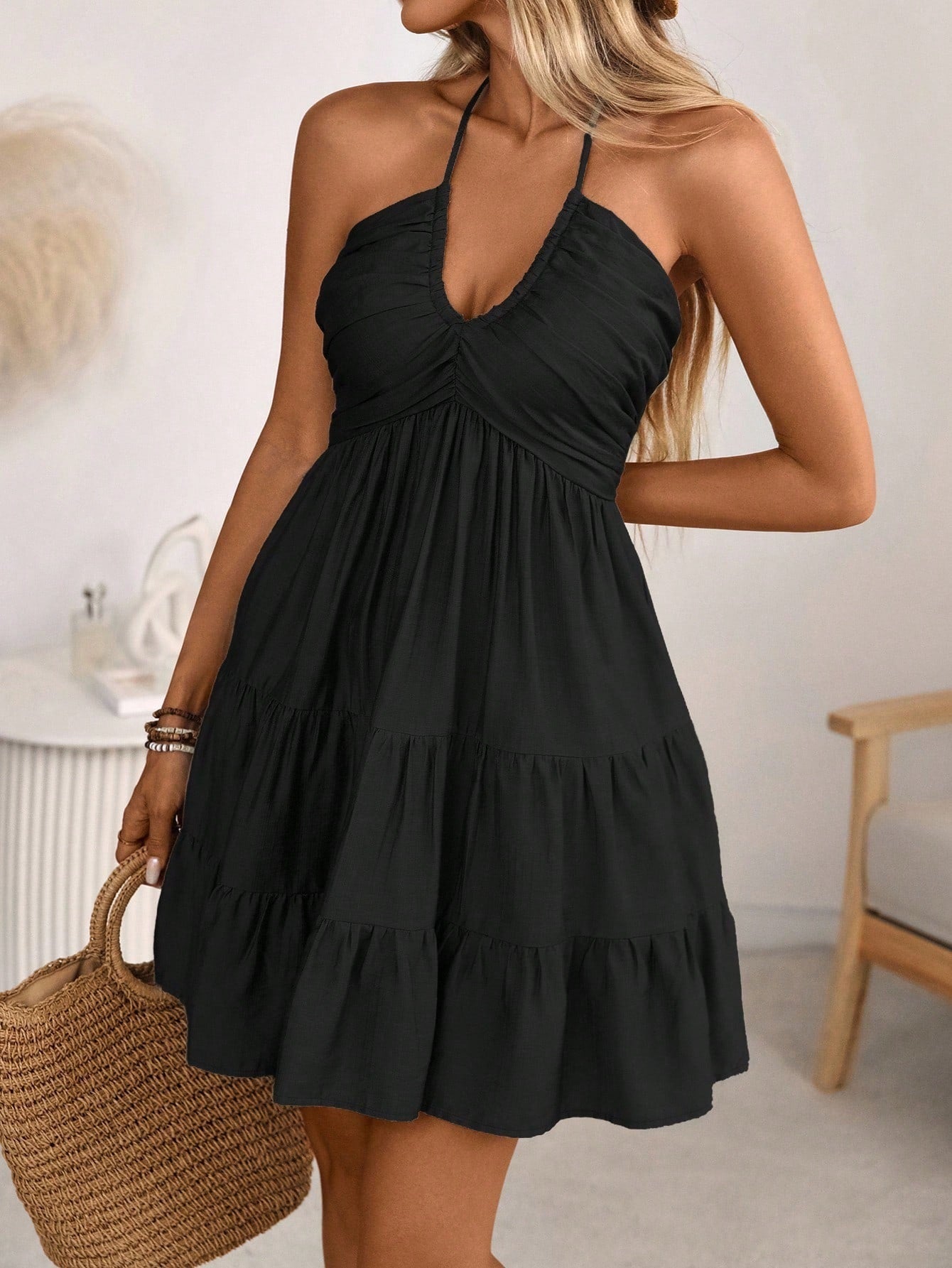 Smocked Halter Neck Tiered Dress in black with ruched bodice and flowing tiers.