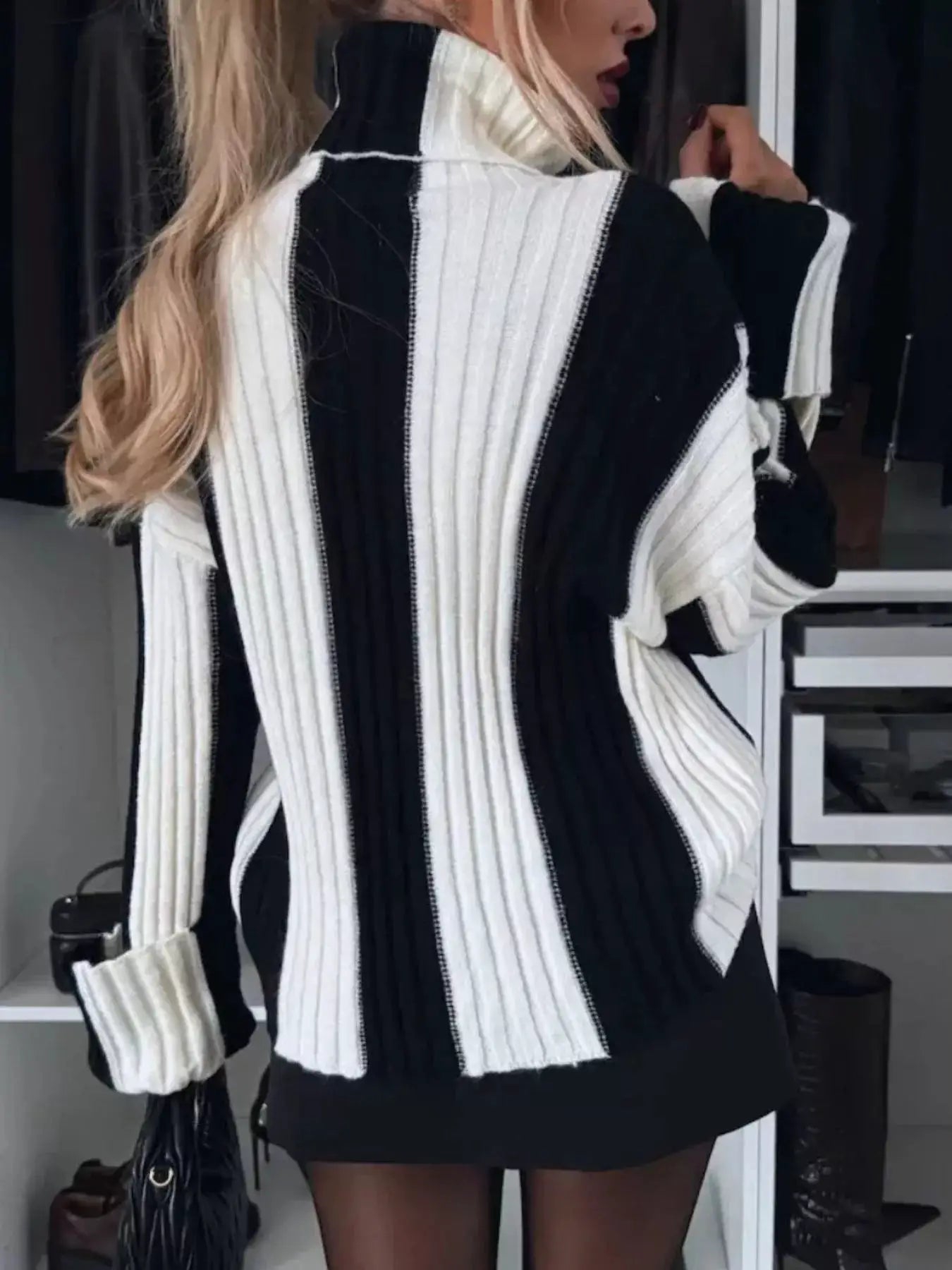 Color Block Ribbed Turtleneck Sweater in black and white knit with vertical ribbing.