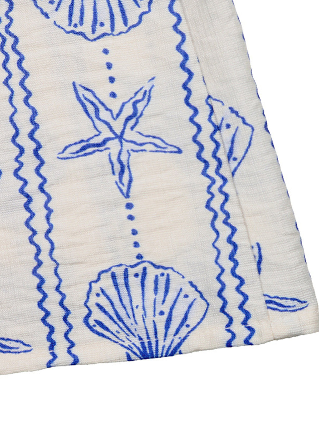 Seashell Print V-Neck Sleeveless Romper by Bellebijouix with cream fabric and blue seashell pattern.
