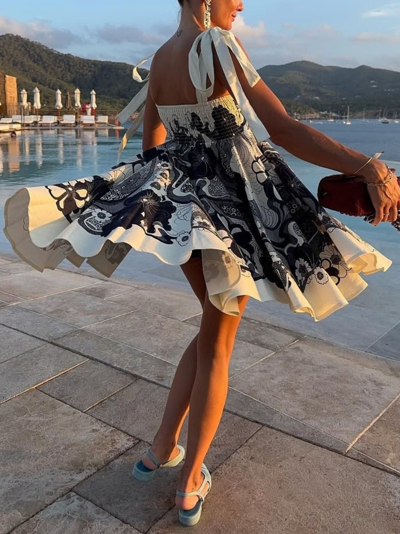 Printed tie-shoulder mini dress in black-and-white print with smocked bodice and pockets