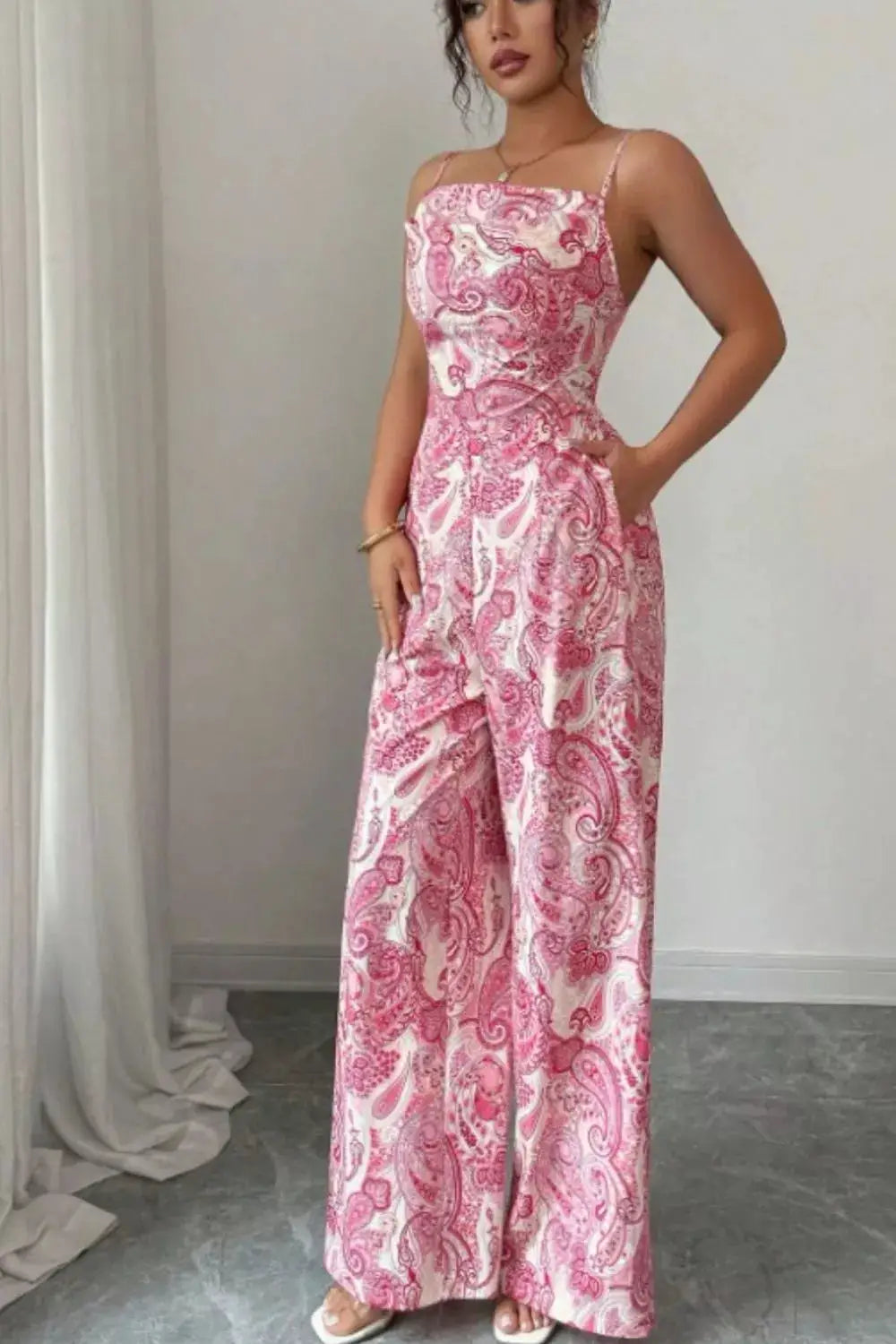 Paisley Print Wide-Leg Jumpsuit by Trendsi; pink and white paisley pattern, spaghetti straps.