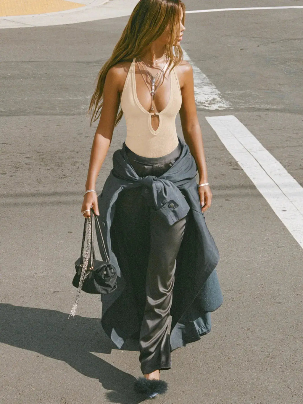 Cutout ribbed tank top beige worn by a model, featuring a plunging neckline with a keyhole cutout.