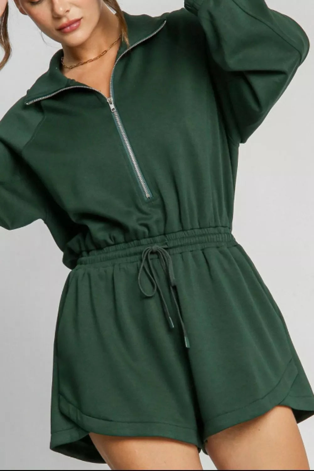 Zip-Up Drawstring Waist Romper in green with long sleeves and front zipper.