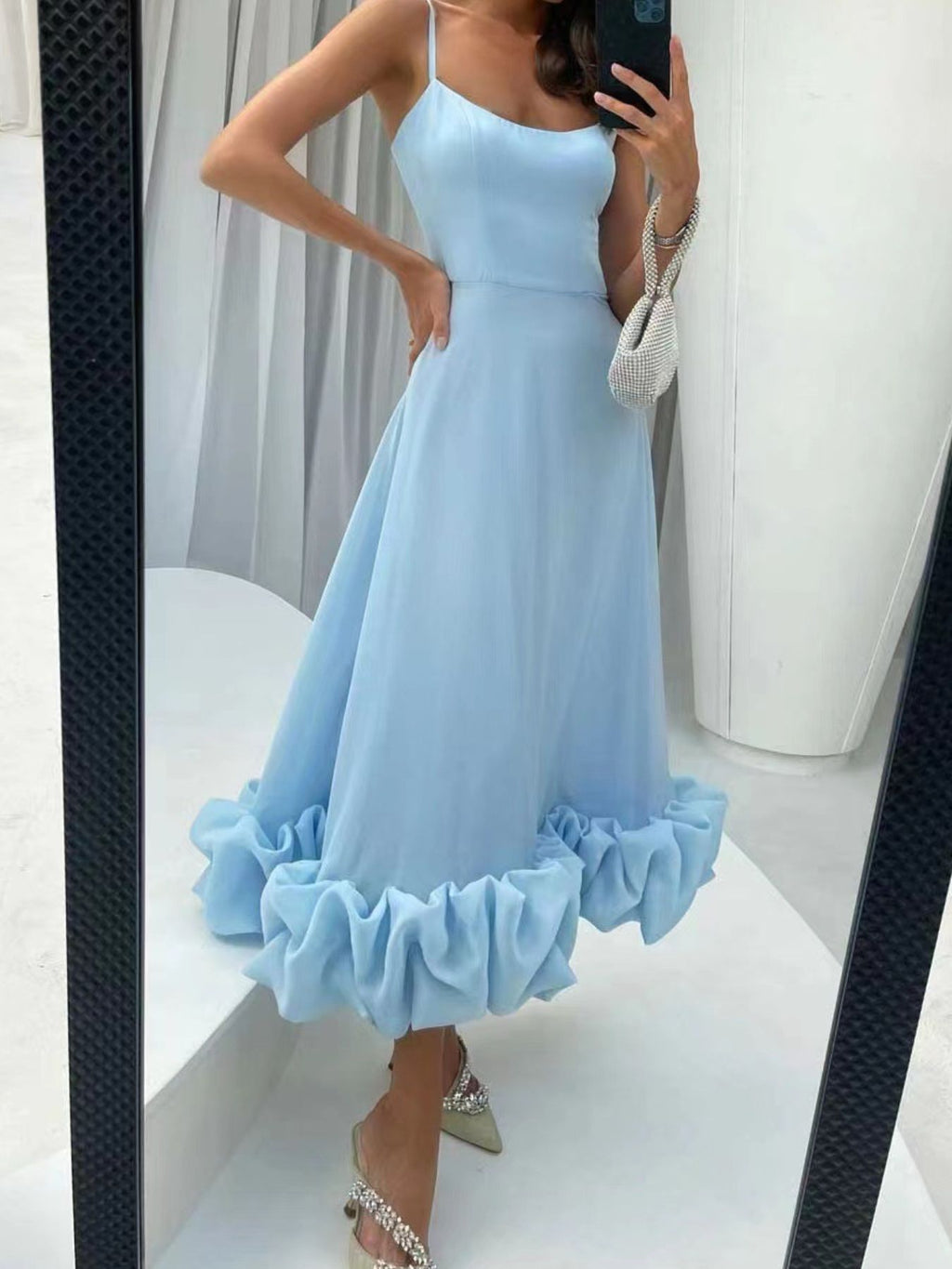 Ruffle-hem scoop-neck midi dress in light blue with thin spaghetti straps.