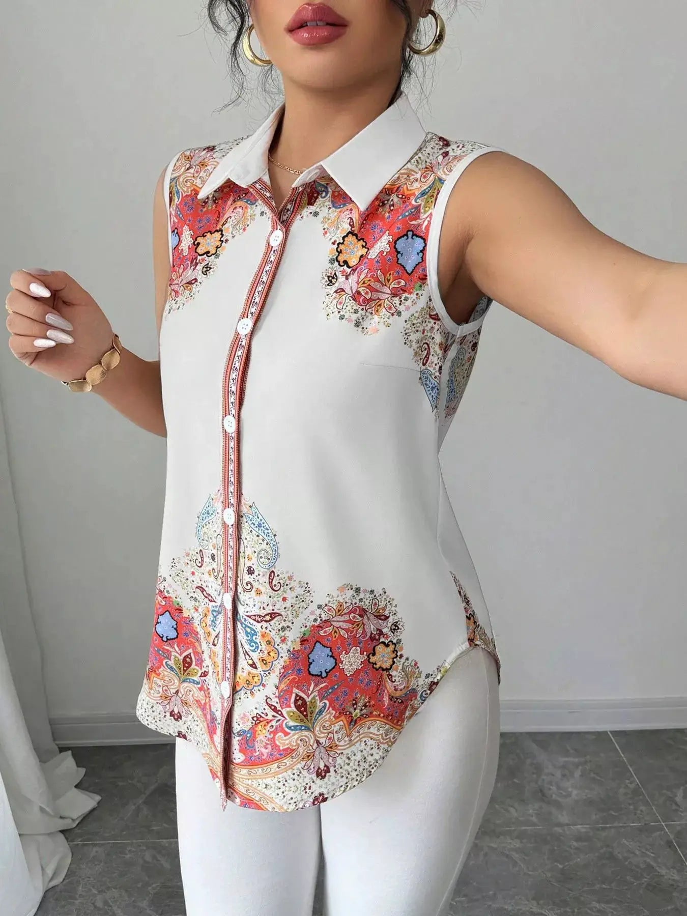Belle Bijouix Button Up Sleeveless Shirt with white collar and colorful paisley floral print.