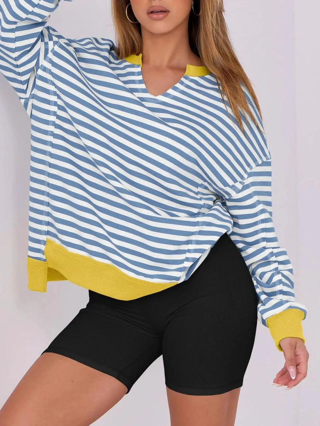 Notched Long Sleeve Oversized Sweatshirt by Belle Bijouix in blue and white stripes with yellow ribbed cuffs and hem.