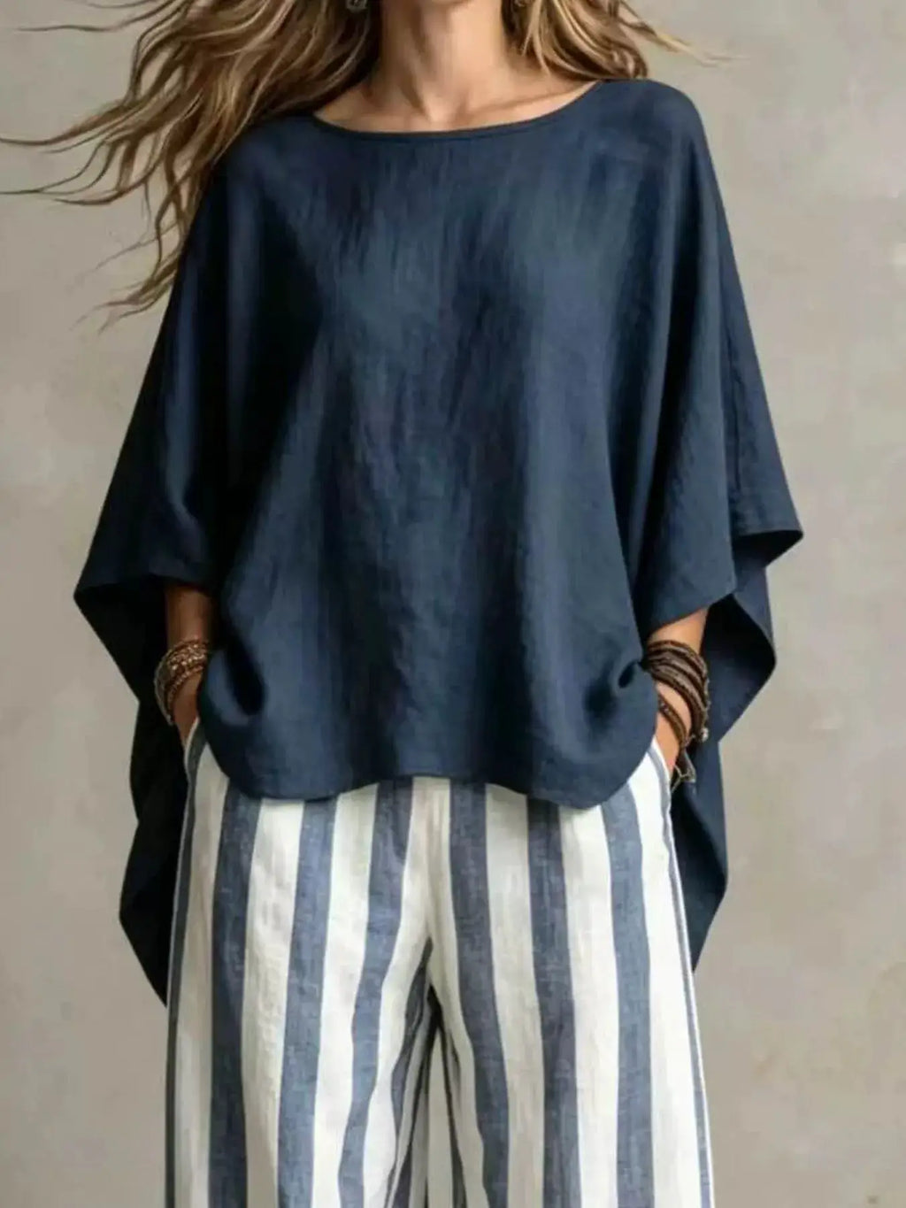 Plus-size outfit set: navy solid top with blue-and-white striped pants by Belle Bijouix.