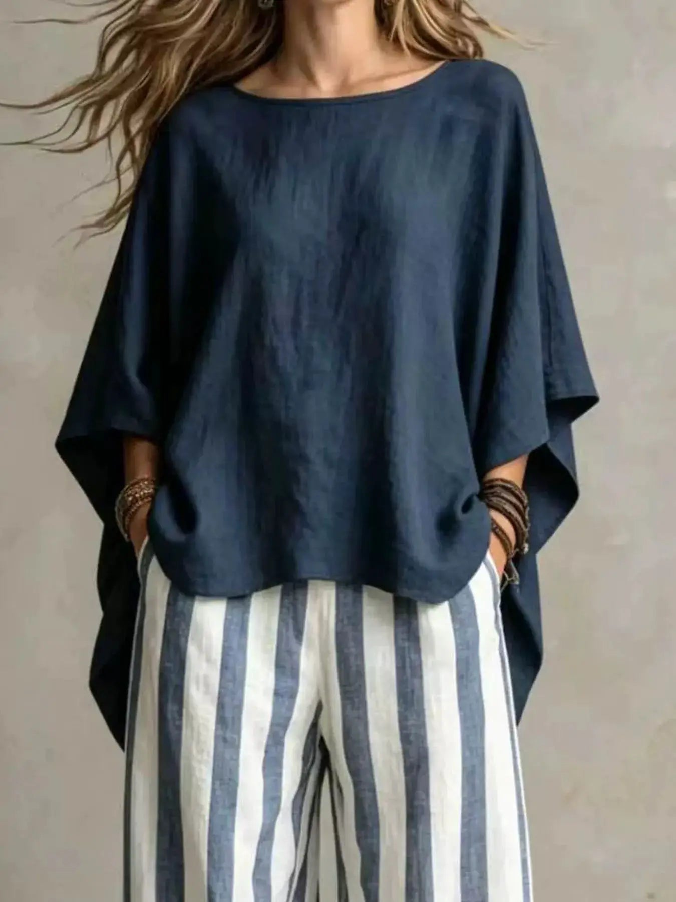 Plus-size outfit set: navy solid top with blue-and-white striped pants by Belle Bijouix.