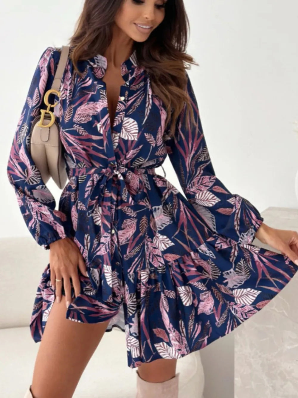 Ruffle-hem floral long-sleeve dress by Belle Bijouix in navy with pink leaves, belted waist