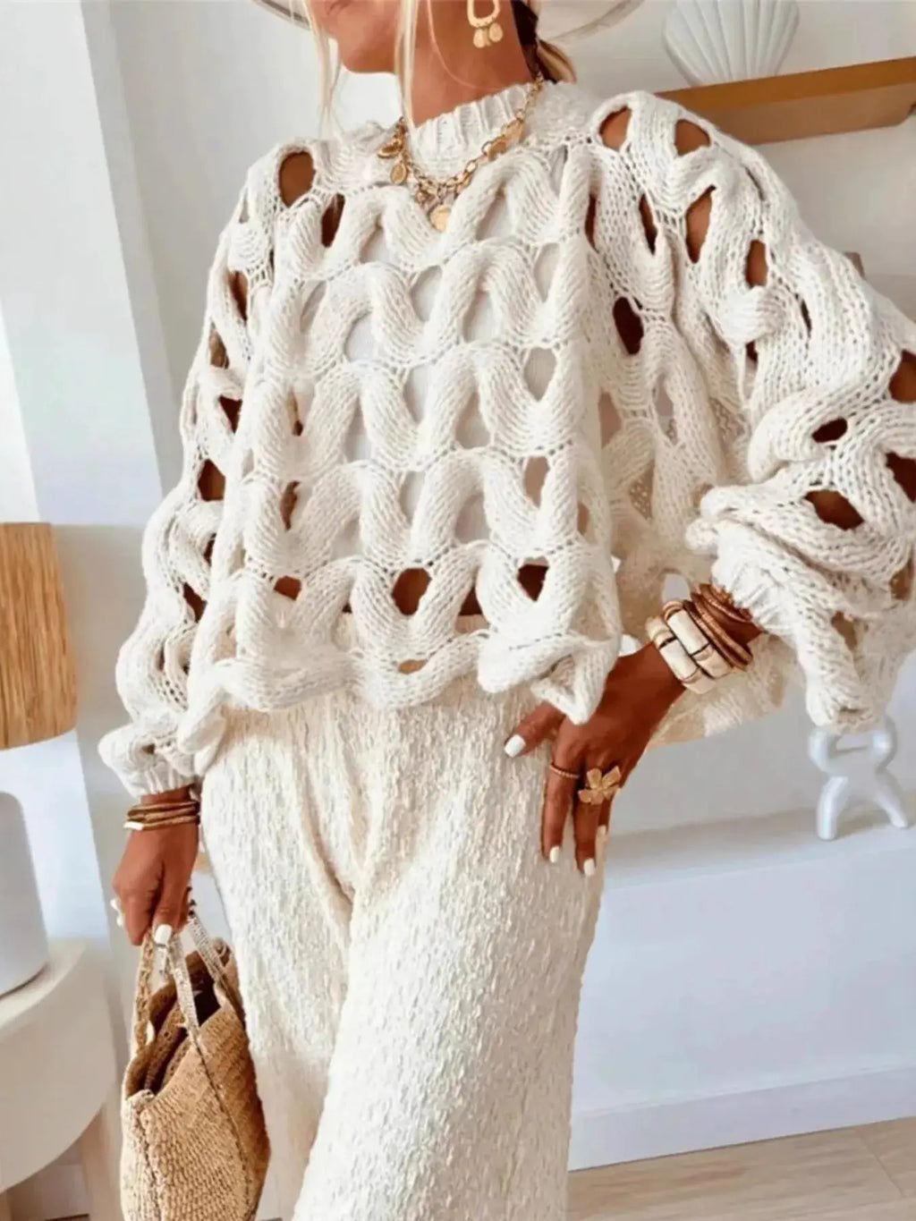 Chunky cable-knit hollow-out sweater in white by Belle Bijouix