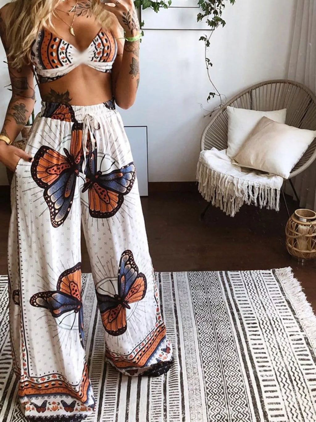 Boho Butterfly Print Top and Pants Set by Trendsi; white fabric with orange and blue butterfly motifs.