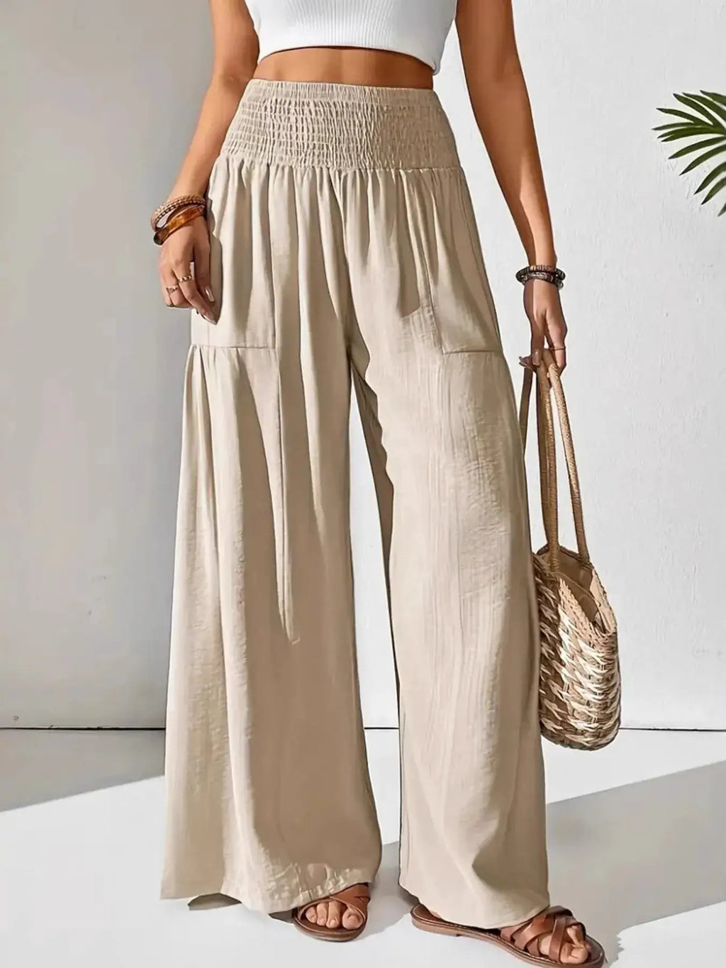 Smocked Waist Wide Leg Pants by Belle Bijouix, beige pocketed bottoms with smocked waistband