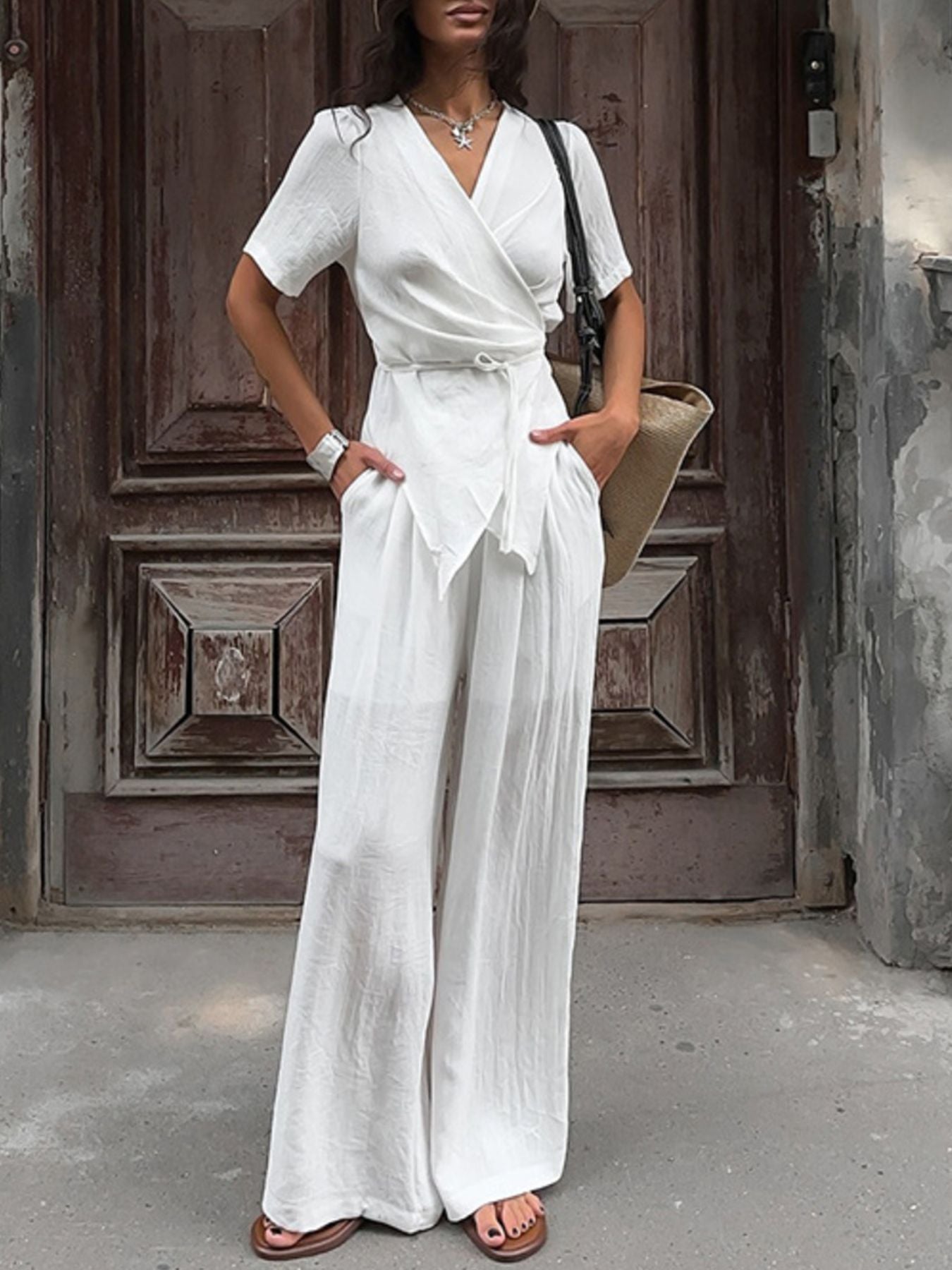 Belle Bijouix Wrap Top & Wide Leg Pants Set in white with a tied belt