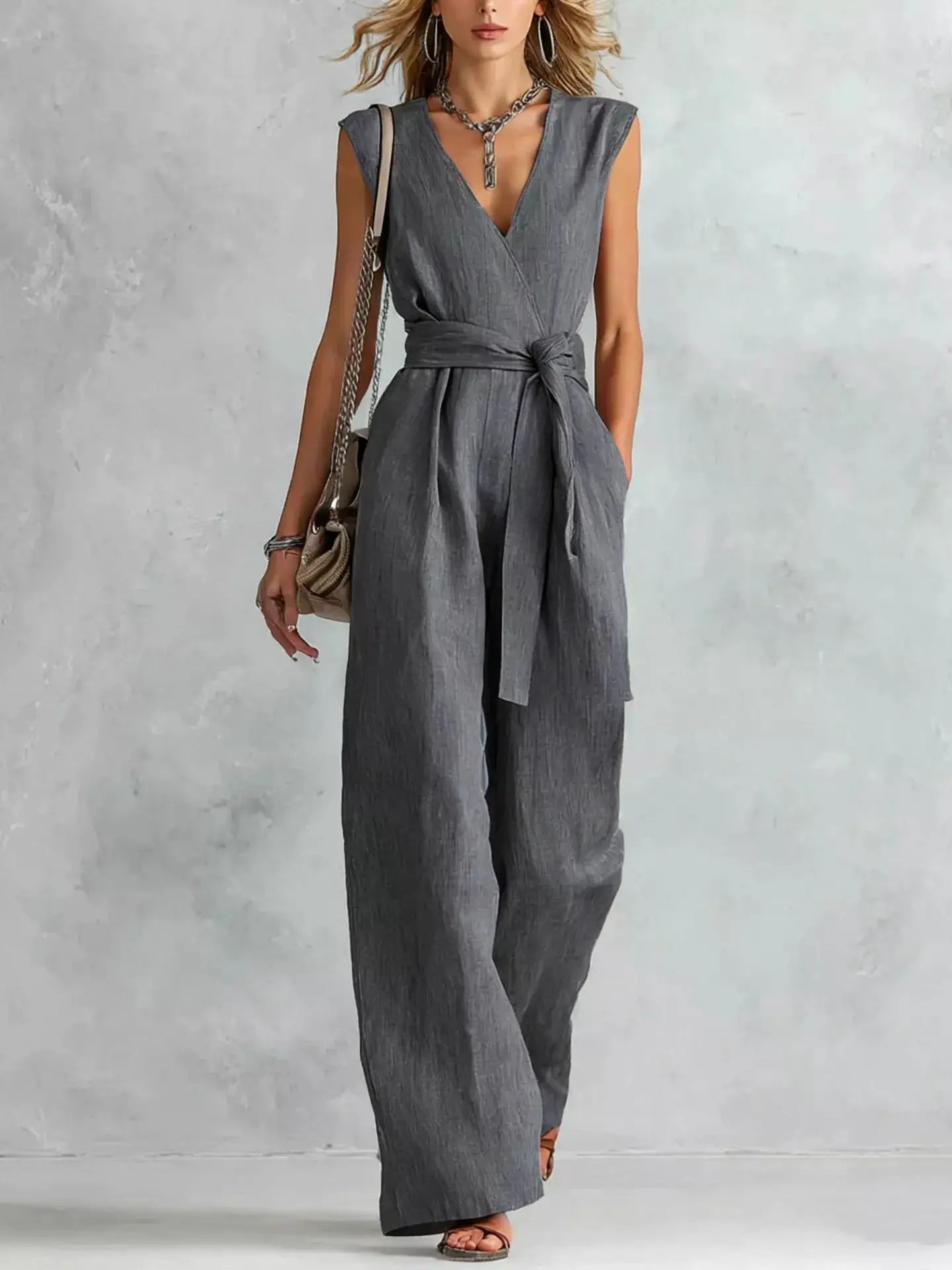 Sleeveless wide-leg jumpsuit in gray linen-look fabric with waist belt by Belle Bijouix.