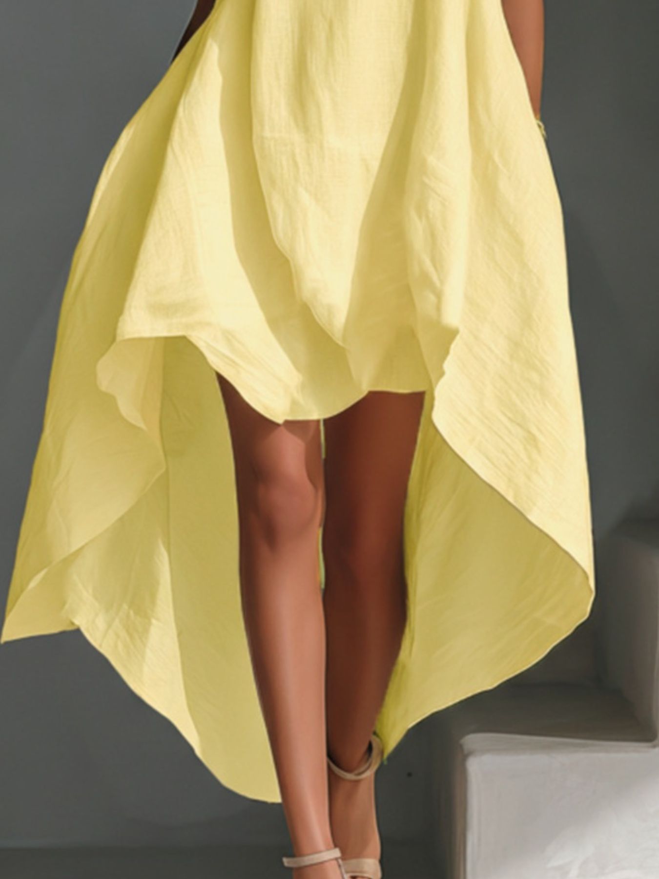 Sleeveless high-low hem dress in pale yellow by Trendsi