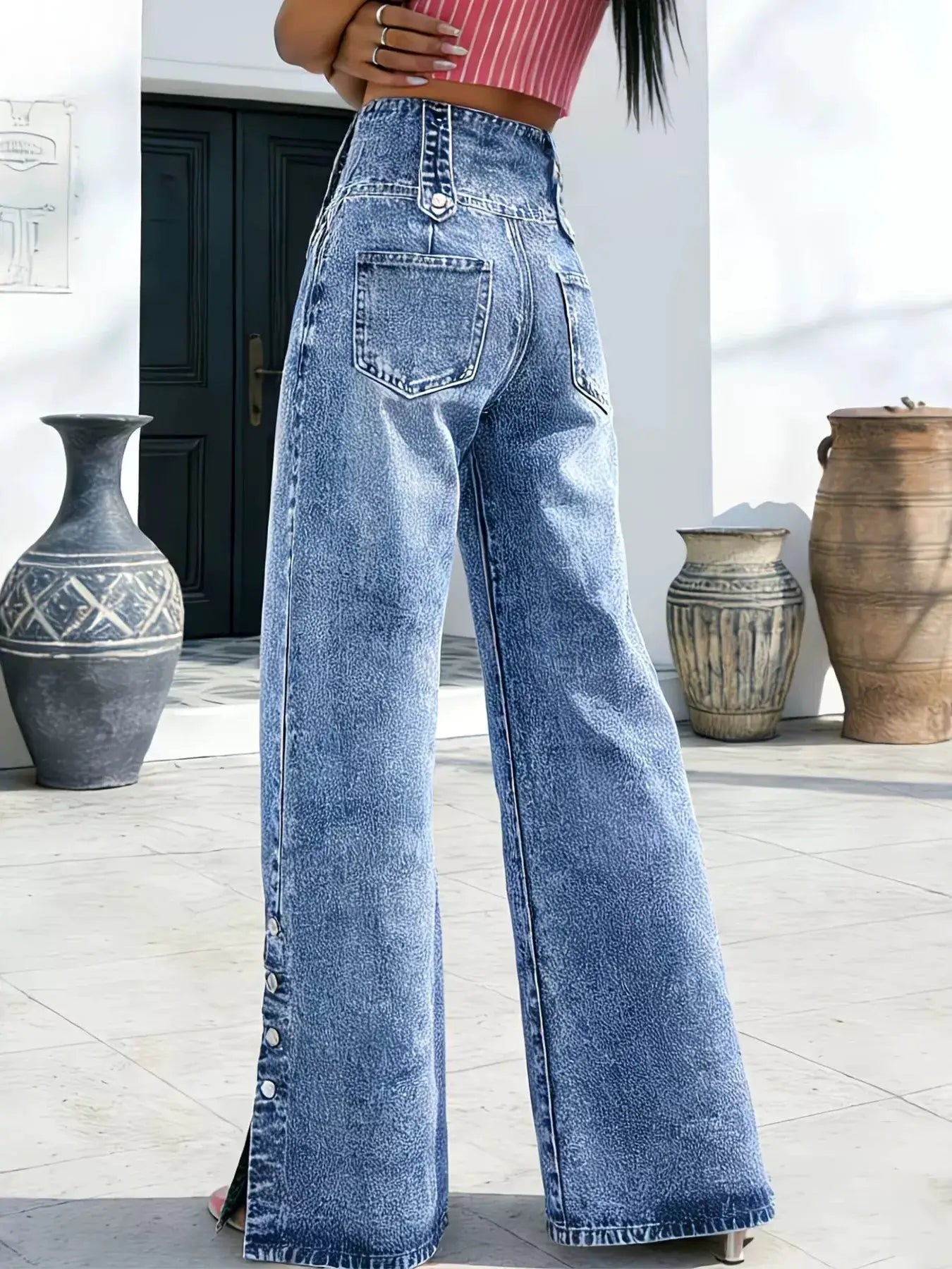 High-waisted wide-leg button-fly jeans by Belle Bijouix in light washed denim
