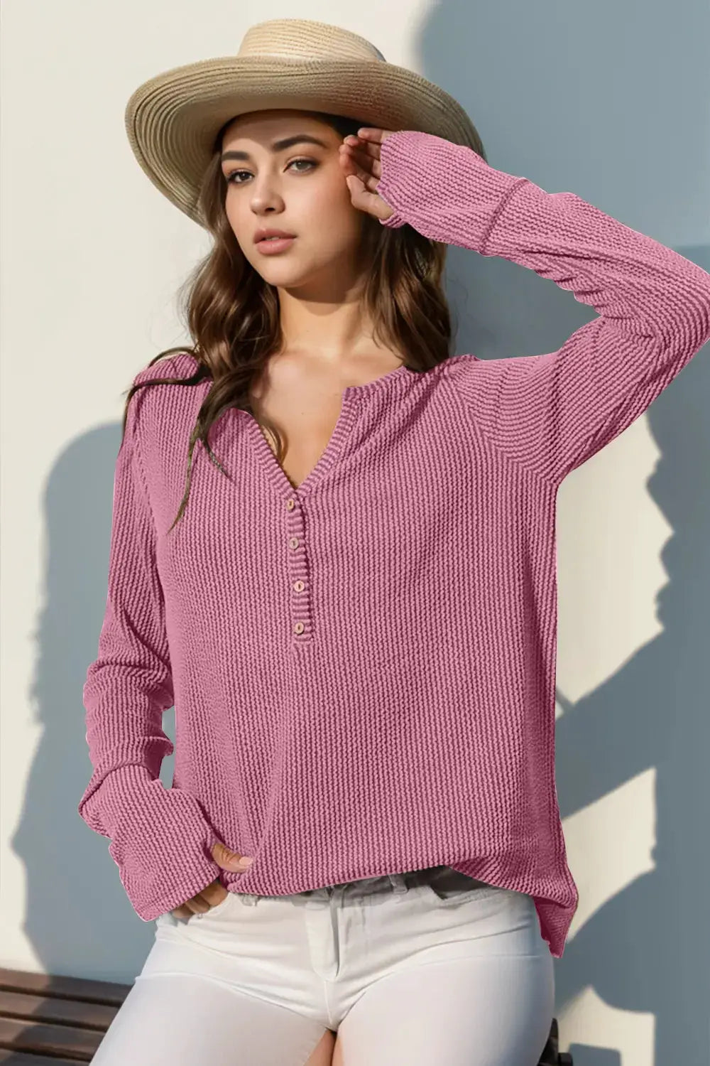 T-shirt in pink knit with notched neckline, long sleeves and button placket