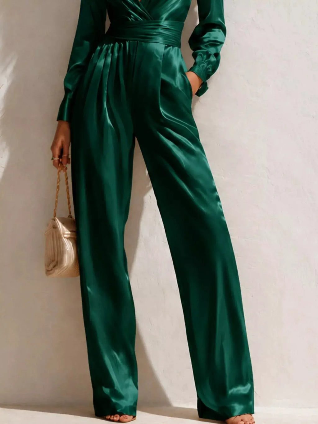 Satin long-sleeve wide-leg jumpsuit in emerald green with waist belt