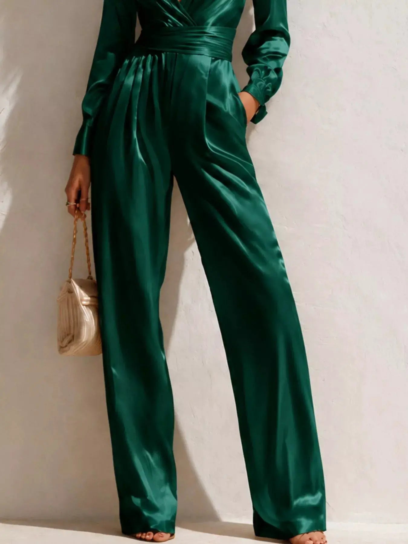 Satin long-sleeve wide-leg jumpsuit in emerald green with waist belt