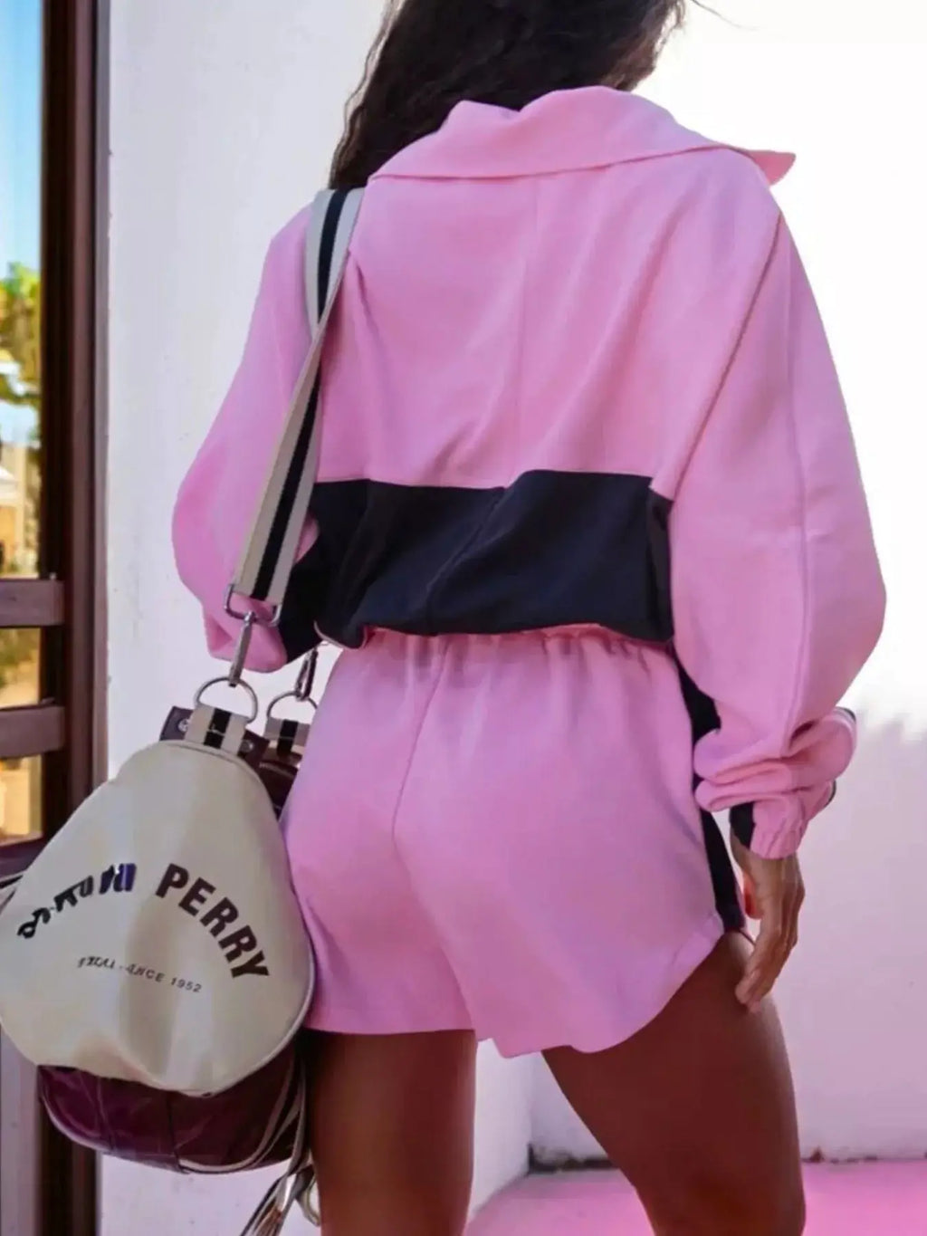 Zip-Up Long Sleeve Top & Shorts Set in pink with a black color-block panel; beige crossbody bag.