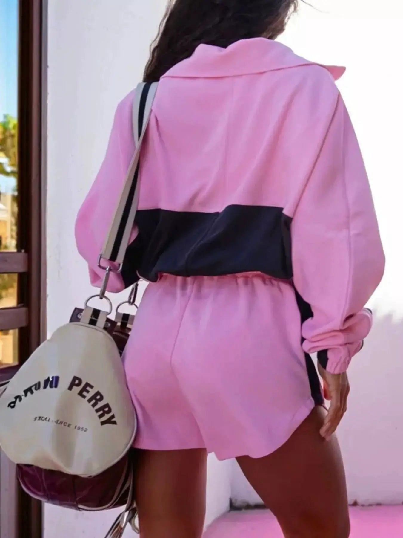 Zip-Up Long Sleeve Top & Shorts Set in pink with a black color-block panel; beige crossbody bag.