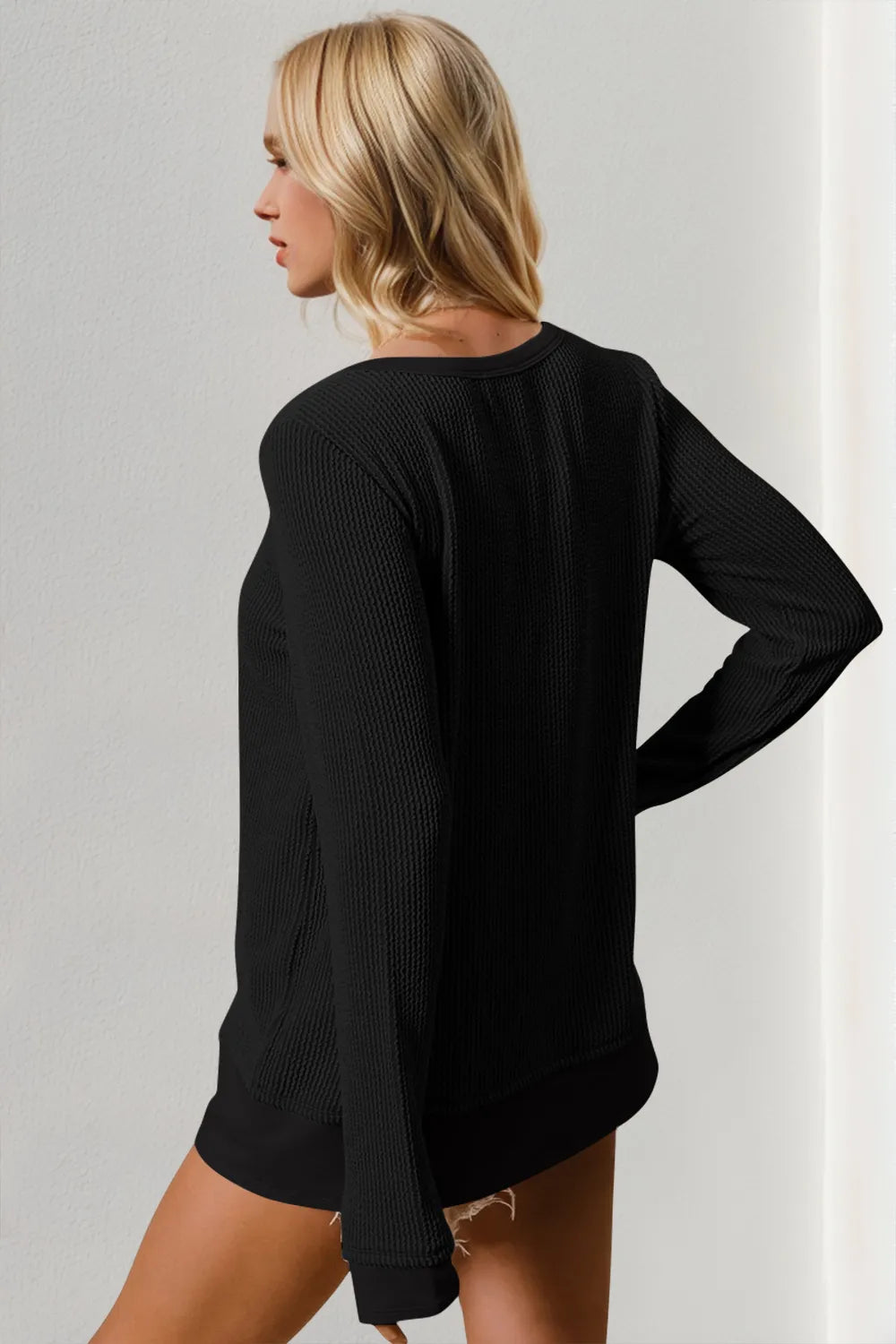 Double Take corded rib thumbhole cuff round-neck T-shirt in black, long-sleeve knit worn by model in profile