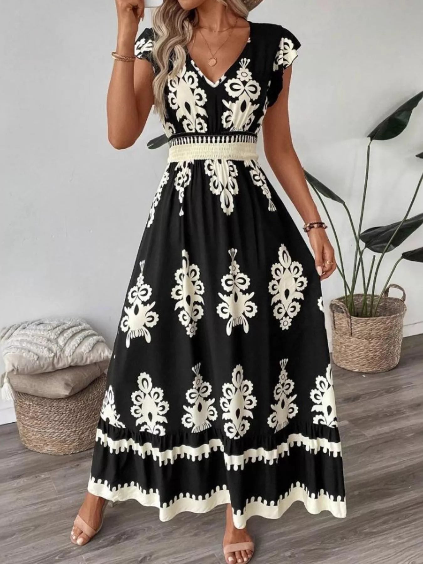 Printed V-Neck Ruffled Cap Sleeve Maxi Dress by Belle Bijouix, black with ivory damask print and smocked waistband.