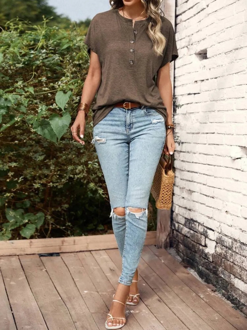 Half Button Short Sleeve Top in olive brown with button placket, paired with ripped light-wash jeans.