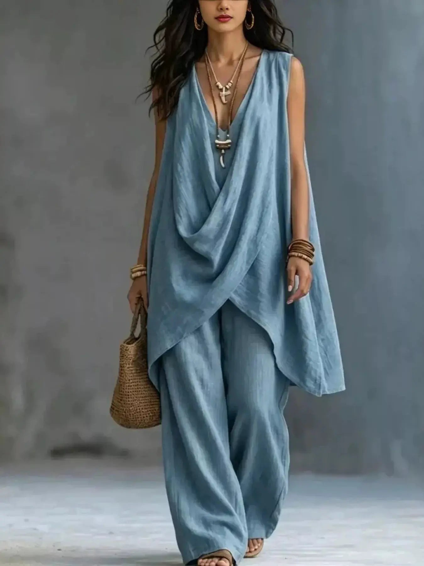 Sleeveless Asymmetrical Top and Wide-Leg Pants Set by Belle Bijouix in blue with draped front.