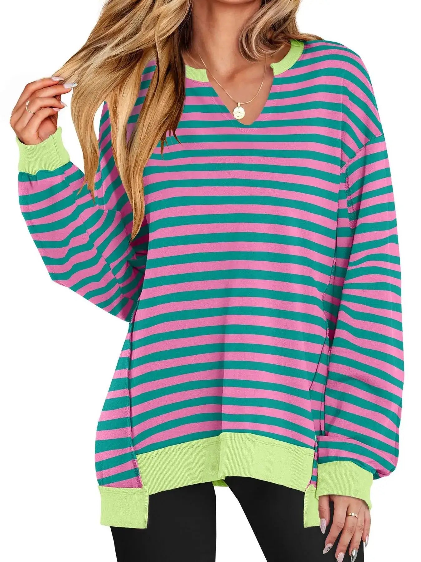Notched long sleeve oversized sweatshirt by Belle Bijouix; pink and teal stripes with neon lime ribbed cuffs and hem.
