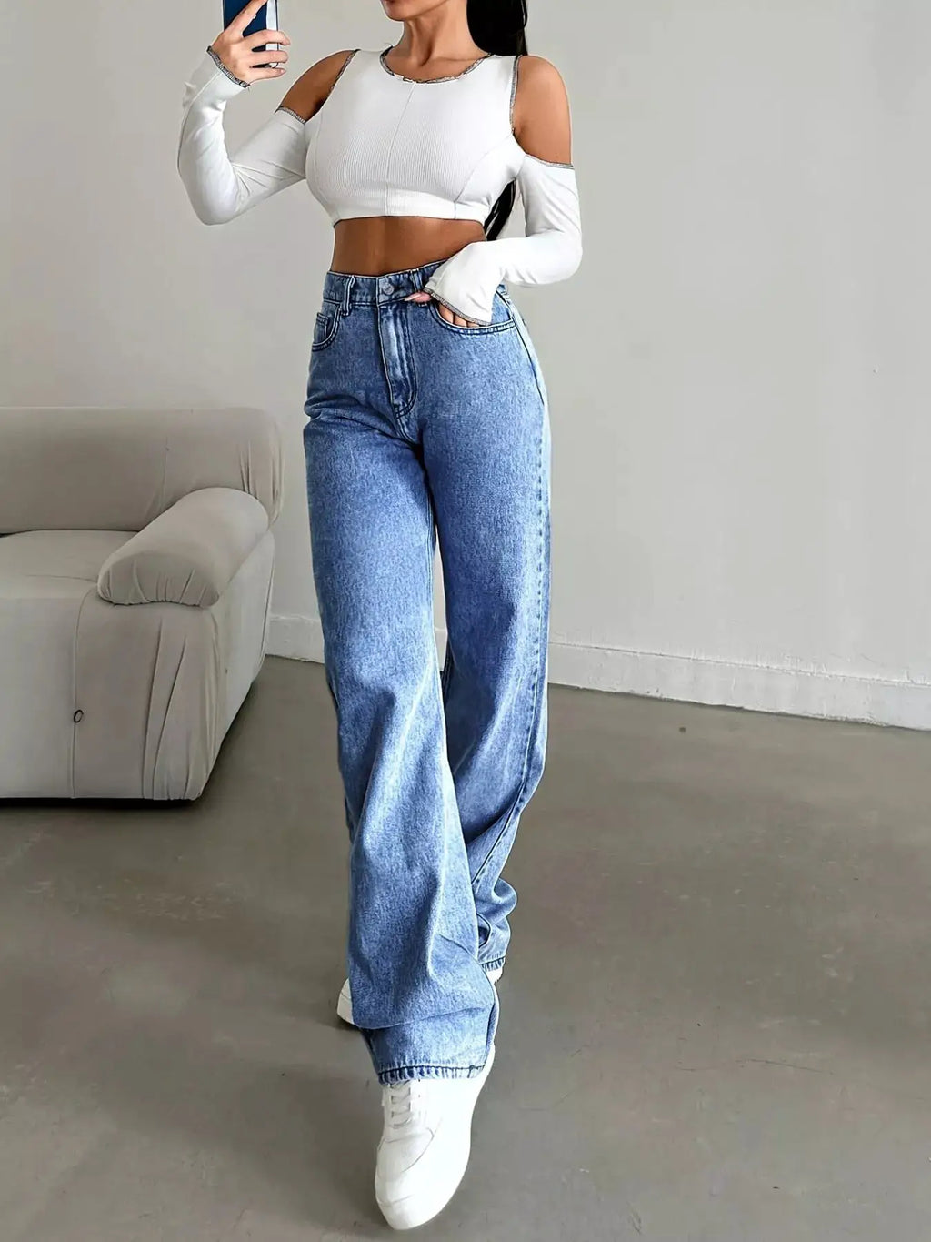High-Waisted Wide-Leg Jeans in light blue denim worn by model