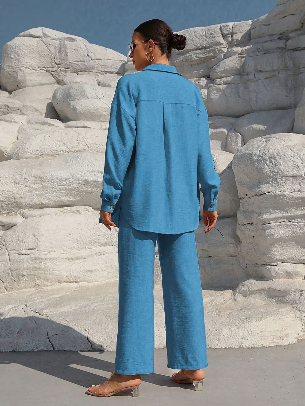 Button Up Long Sleeve Shirt and Pants Set in blue by Trendsi, back view.