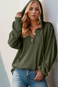 Full-size hoodie top with a half-button placket in olive green knit, long sleeves