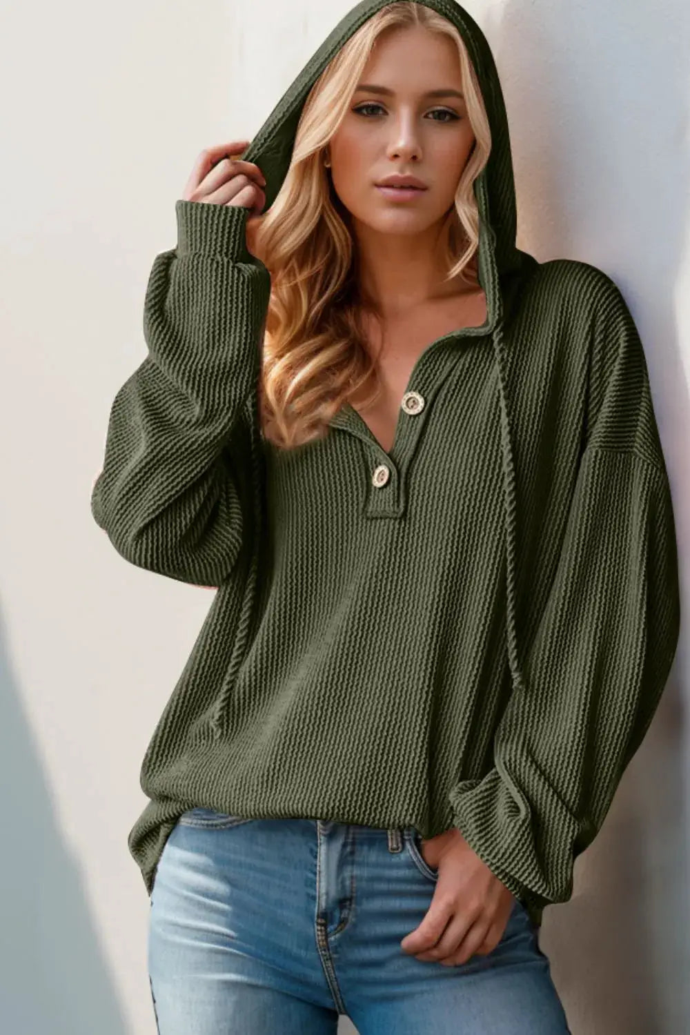 Full-size hoodie top with a half-button placket in olive green knit, long sleeves