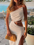 Cutout Tied Split Maxi Dress by Bellebijouix in cream; one-shoulder with waist cutout and high slit, plus woven clutch.
